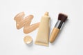 Liquid foundation, makeup brush and swatch on white background, flat lay Royalty Free Stock Photo