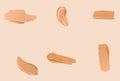 Liquid foundation smudges, smears and strokes as makeup textures isolated on beige background, beauty and cosmetics
