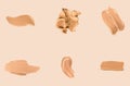 Liquid foundation smudges, smears and strokes as makeup textures isolated on beige background, beauty and cosmetics