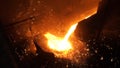 Liquid metal from blast furnace. Liquid iron from ladle in the steelworks Royalty Free Stock Photo