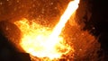 Liquid metal from blast furnace. Liquid iron from ladle in the steelworks Royalty Free Stock Photo