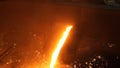 Liquid metal from blast furnace. Liquid iron from ladle in the steelworks Royalty Free Stock Photo