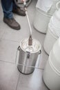 Liquid nitrogen technician fills container Royalty Free Stock Photo