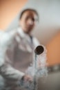 Liquid nitrogen technician fills container Royalty Free Stock Photo