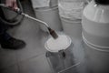 Liquid nitrogen technician fills container Royalty Free Stock Photo