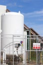 Liquid oxygen tank in hospital with warning label for safety control flammable,safety industrial concept Royalty Free Stock Photo