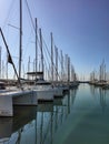 Liquid path between moored yachts with masts at Alimos Marina, Athens, Greece Royalty Free Stock Photo