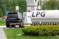 Liquid propane gas station. Black modern SUV car refueling tank with alternative power natural liquefied fuel