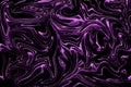 Liquid purple glitter paint swirls on black background Royalty Free Stock Photo