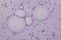 Liquid serum, gel bubbles in light purple color Royalty Free Stock Photo