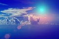 Cloudy blue sky on a sunny day. The Sun and the Sun`s rays against the blue sky and clouds. Royalty Free Stock Photo