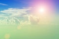 Cloudy blue sky on a sunny day. The Sun and the Sun`s rays against the blue sky and clouds. Royalty Free Stock Photo