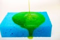 liquid soap falling on a sponge Royalty Free Stock Photo