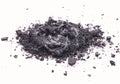 Liquid and solid black natural cosmetic activated charcoal or volcanic clay with scrub effect on white background