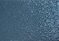 Liquid water droplets, abstract shapes, small and big on a black Royalty Free Stock Photo