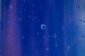 Liquid water drops texture on an abstract background on blue shades Royalty Free Stock Photo