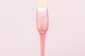 liquid wax for pink depilation drains from the stick. The concept of depilation, waxing,