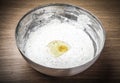 Liquid white dough whisk with herbs and a broken egg Royalty Free Stock Photo
