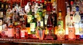 Liquor bottles behind a bar.