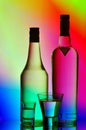 Liquor bottles and shot glasses Royalty Free Stock Photo