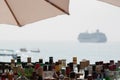 Liquor Bottles in a Tropical Beach Bar with Cruise Boat Royalty Free Stock Photo