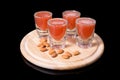 Liquor shots with almonds Royalty Free Stock Photo