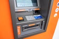 Lisboa, Portugal. 09 03 2023 Detail of an orange automatic teller machine, ATM
