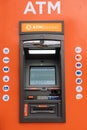 Lisboa, Portugal. 09 03 2023 Detail of an orange automatic teller machine, ATM