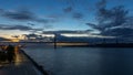 Lisbon city before sunrise with April 25 bridge night to day Royalty Free Stock Photo