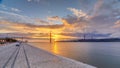 Lisbon city sunrise with April 25 bridge night to day Royalty Free Stock Photo