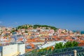 Lisbon cityscape, aerial panoramic view of Lisboa historical city centre with colorful buildings red tiled roofs, Sao Jorge Castle Royalty Free Stock Photo