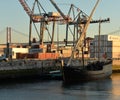 Lisbon harbour, Portugal. Containers and old wooden ship