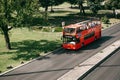 Lisbon, June 18, 2018: A red tourist bus with tourists rides around the city. Lisbon Sightseeing.