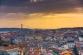 Lisbon panoramic view. Colorful walls of the buildings of Lisbon, with orange roofs and the 25th of April bridge in the background Royalty Free Stock Photo