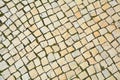 Lisbon pavement made of limestone squares background