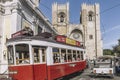 Tram and tuk tuk in front of Lisbon Cathedral Royalty Free Stock Photo
