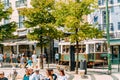 Tourists exploring square of Luis de Camoes in Lisbon