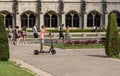 Boy riding Circ scooter by Jeronimos Monastery in Belem near Lisbon, Portugal Royalty Free Stock Photo