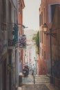 Lisbon, Portugal - 01/03/19: Beautiful narrow street, motor bike