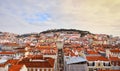 Lisbon Portugal - Beautiful panoramic view of the red roofs of houses in antique historical district Alfama and the Tagus River Royalty Free Stock Photo