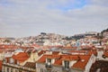 Lisbon Portugal - Beautiful panoramic view of the red roofs of houses in antique historical district Alfama and the Tagus River Royalty Free Stock Photo