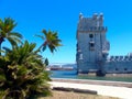 Lisbon, Portugal, Belem tower or Torre de Belem with green palm trees Royalty Free Stock Photo