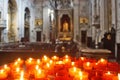 Lisbon, Portugal: burning red sacrificial candles in church Royalty Free Stock Photo