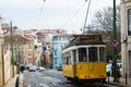 Lisbon, Portugal: CalÃÂ§ada (sidewalk) da Estrela and a yellow tramway