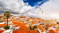 Lisbon, Portugal city skyline over the Alfama district with seagulls flying over the city. Summertime sunshine day cityscape in Royalty Free Stock Photo