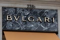 Bvlgari letters logo above the shop window on marble background. Royalty Free Stock Photo