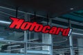 Motocard logo sign at the motor store. Royalty Free Stock Photo