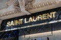 Shinny gold Saint Laurent letters logo above the shop window.
