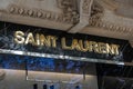 Shinny gold Saint Laurent letters logo above the shop window.