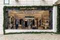 Shinny gold Saint Laurent letters logo above the shop window.